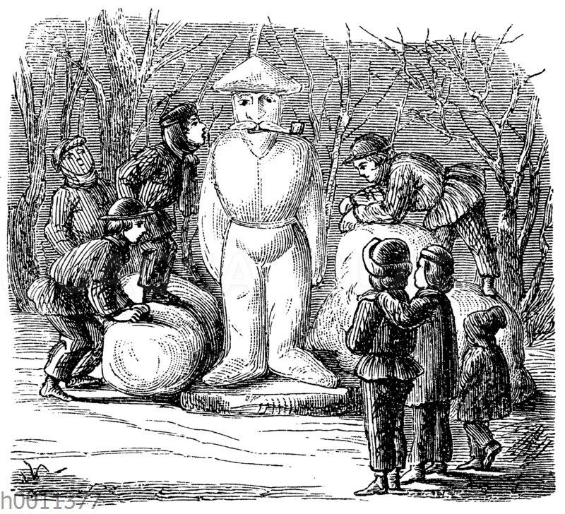 Kinder bauen einen Schneemann